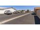 Exterior view displaying the parking lot with multiple parking spots and well-kept surroundings at 13608 W Aleppo Dr, Sun City West, AZ 85375