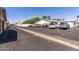 Exterior image highlighting the well-maintained parking area with ample spaces and easy access at 13608 W Aleppo Dr, Sun City West, AZ 85375