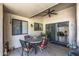 Enclosed patio with a ceiling fan, perfect for outdoor dining and relaxation at 13608 W Aleppo Dr, Sun City West, AZ 85375
