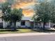 Charming single-story home featuring a well-manicured lawn and mature shade trees at 14439 N 38Th Pl, Phoenix, AZ 85032