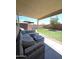 Enjoy outdoor living on the covered patio with views of the green backyard at 15023 W Redfield Rd, Surprise, AZ 85379