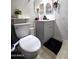 Bathroom featuring a grey vanity, decorative mirror and a toilet at 15023 W Redfield Rd, Surprise, AZ 85379