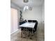 Modern dining room featuring tile floor, hanging lights, and contemporary furniture at 15023 W Redfield Rd, Surprise, AZ 85379