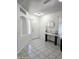 Bright foyer featuring tile flooring, a decorative alcove, and an elegant entry table at 15023 W Redfield Rd, Surprise, AZ 85379