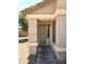 Inviting front entry with stone columns and a small window, providing natural light at 15023 W Redfield Rd, Surprise, AZ 85379