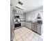 Well-lit kitchen with stainless steel appliances, granite countertops, and updated cabinets at 15023 W Redfield Rd, Surprise, AZ 85379