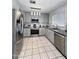 Updated kitchen featuring stainless steel appliances, granite countertops, and modern lighting at 15023 W Redfield Rd, Surprise, AZ 85379