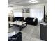 Inviting living room featuring tile flooring, modern decor, and great lighting at 15023 W Redfield Rd, Surprise, AZ 85379