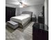 Cozy bedroom with a ceiling fan, comfortable bed, and gray walls at 15023 W Redfield Rd, Surprise, AZ 85379