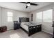 Comfortable bedroom featuring a ceiling fan, window with blinds, and carpet floors at 15028 W Minnezona Ave, Goodyear, AZ 85395