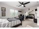 This bedroom features a closet with sliding mirror doors and neutral colored walls at 15028 W Minnezona Ave, Goodyear, AZ 85395