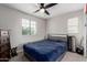 Bedroom featuring a ceiling fan, window with blinds, and carpet floors at 15028 W Minnezona Ave, Goodyear, AZ 85395