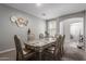 Sophisticated dining room with a six-chair dining set and elegant decorations at 15028 W Minnezona Ave, Goodyear, AZ 85395