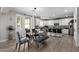Bright kitchen featuring dining area and barstool seating at 15028 W Minnezona Ave, Goodyear, AZ 85395