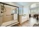 Bathroom showcasing a walk-in shower with glass door and a separate soaking tub at 15211 N 184Th Ct, Surprise, AZ 85388