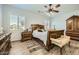 Comfortable bedroom with traditional furniture, shuttered windows, and light-colored walls at 15211 N 184Th Ct, Surprise, AZ 85388