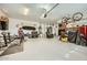Large garage featuring overhead storage, workbench, and ample space for projects at 15211 N 184Th Ct, Surprise, AZ 85388