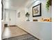 Entryway with light wood floors, art niche, and a door with sidelight at 15211 N 184Th Ct, Surprise, AZ 85388