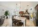 Bright, open kitchen with a large island, stainless steel appliances, and wood floors at 15211 N 184Th Ct, Surprise, AZ 85388