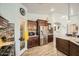 Bright kitchen featuring stainless steel appliances, granite countertops, and wood-look flooring at 15211 N 184Th Ct, Surprise, AZ 85388