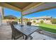 Charming covered patio perfect for outdoor dining and entertaining at 15211 N 184Th Ct, Surprise, AZ 85388