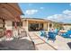 Enjoy the outdoor living space with a built-in BBQ, covered patio, and additional seating areas at 15849 W Alvarado Dr, Goodyear, AZ 85395