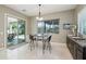 Charming breakfast nook features natural light with backyard views and sliding glass door access to the patio at 15849 W Alvarado Dr, Goodyear, AZ 85395
