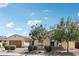 Charming single-story home with well-maintained landscaping, a two-car garage, and a welcoming entrance at 15849 W Alvarado Dr, Goodyear, AZ 85395
