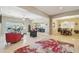 Open-concept living area flowing into the kitchen and dining room, showcasing a spacious and modern design at 15849 W Alvarado Dr, Goodyear, AZ 85395