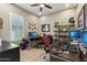 Functional office area with modern desks, ergonomic chairs, and ample natural light for productivity at 15849 W Alvarado Dr, Goodyear, AZ 85395
