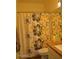 Bright bathroom featuring a floral shower curtain and well-lit vanity area at 1701 E Colter St # 280, Phoenix, AZ 85016