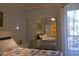 Cozy bedroom with sliding mirror closet reflecting a full view of the room and natural light at 1701 E Colter St # 280, Phoenix, AZ 85016