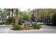 Biltmore Square condominium complex entrance with lush landscaping and mature trees at 1701 E Colter St # 280, Phoenix, AZ 85016