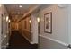 A well lit community hallway featuring neutral walls and framed art at 1701 E Colter St # 280, Phoenix, AZ 85016
