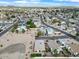 An aerial view shows this home situated in a well-kept, desert neighborhood with mountain views at 17912 N 88Th Dr, Peoria, AZ 85382