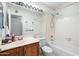 Bathroom with tile, tub and shower combination, vanity and commode at 17912 N 88Th Dr, Peoria, AZ 85382