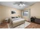 Inviting bedroom with warm neutral tones, ceiling fan, and bright natural light at 17912 N 88Th Dr, Peoria, AZ 85382