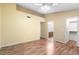 Open and empty bedroom with hardwood flooring, ceiling fan, and natural light at 17912 N 88Th Dr, Peoria, AZ 85382
