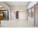 Dining area with stainless steel fridge and sliding glass doors. Tile floors at 17912 N 88Th Dr, Peoria, AZ 85382