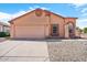 Charming single-story home with a two-car garage and low-maintenance desert landscaping at 17912 N 88Th Dr, Peoria, AZ 85382