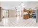 Open-concept kitchen and living area with natural light and stainless steel appliances at 17912 N 88Th Dr, Peoria, AZ 85382