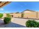 Inviting backyard with a cozy fire pit area and comfortable seating, perfect for outdoor entertaining at 17958 W Udall Dr, Surprise, AZ 85374