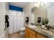 Bathroom featuring a sink with granite countertop and a shower with a white shower curtain at 17958 W Udall Dr, Surprise, AZ 85374