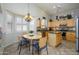 Bright eat-in kitchen featuring a breakfast nook and maple cabinetry with granite countertops at 17958 W Udall Dr, Surprise, AZ 85374