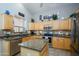 Charming kitchen featuring granite countertops, stainless appliances, and bright lighting at 17958 W Udall Dr, Surprise, AZ 85374
