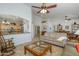 Open-concept living room showcasing tile flooring and seamless transition to other living spaces at 17958 W Udall Dr, Surprise, AZ 85374