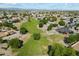 Aerial view of the community, showcasing the neighborhood layout, green spaces, and residential houses at 1887 W Desert Seasons Dr, Queen Creek, AZ 85144