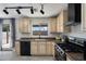 Modern kitchen showcasing light wood cabinets, stainless steel appliances, and an open window above the sink at 1887 W Desert Seasons Dr, Queen Creek, AZ 85144