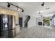 Open-concept living space showcases modern tile flooring, a cozy fireplace, and access to a contemporary kitchen at 1887 W Desert Seasons Dr, Queen Creek, AZ 85144