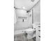 Modern bathroom with frameless shower and white vanity with dark fixtures at 1961 N Hartford St # 1162, Chandler, AZ 85225
